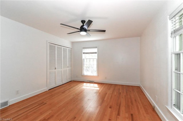 unfurnished room featuring ceiling fan and light hardwood / wood-style floors