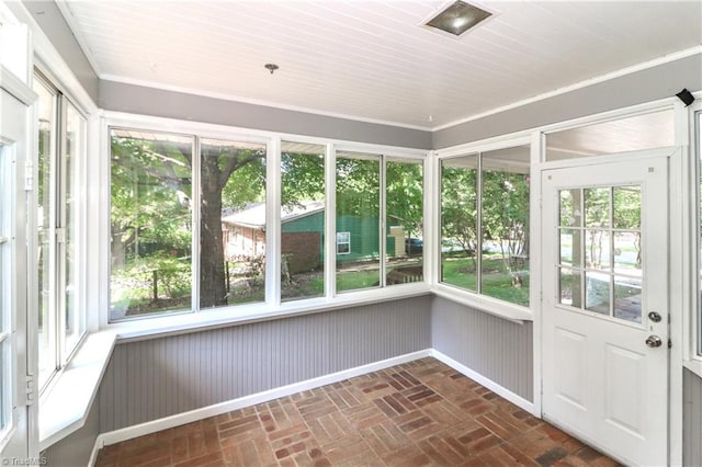 unfurnished sunroom with plenty of natural light