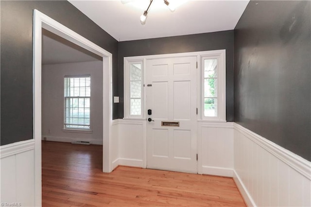 foyer featuring a healthy amount of sunlight and light hardwood / wood-style flooring