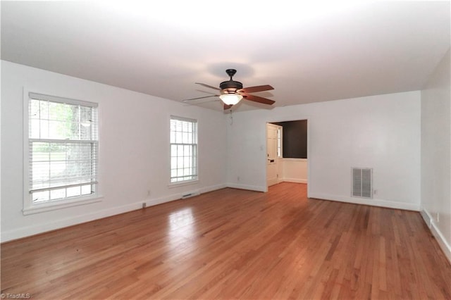 interior space with light hardwood / wood-style flooring, ceiling fan, and a healthy amount of sunlight