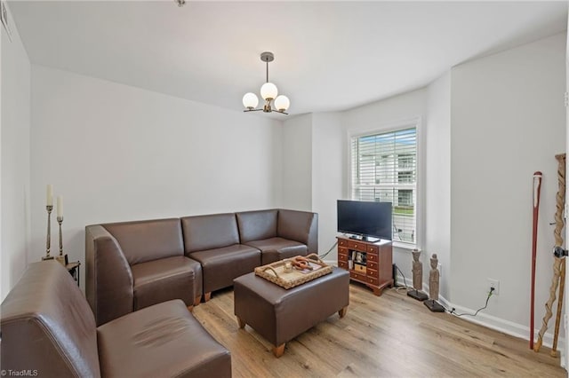 221 Quietwood Dr Unit 221, Winston-Salem, NC 27103 - living room featuring light wood-style floors and a chandelier
