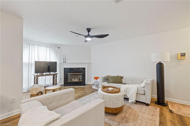 221 Quietwood Dr Unit 221, Winston-Salem, NC 27103 - living room with ceiling fan, wood finished floors, and a fireplace