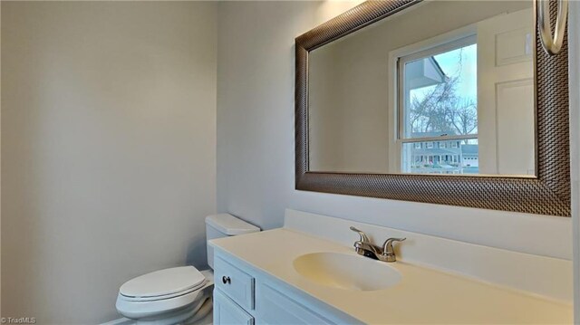 half bath with toilet and vanity