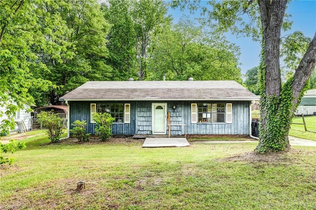ranch-style home with a porch, board and batten siding, and a front yard