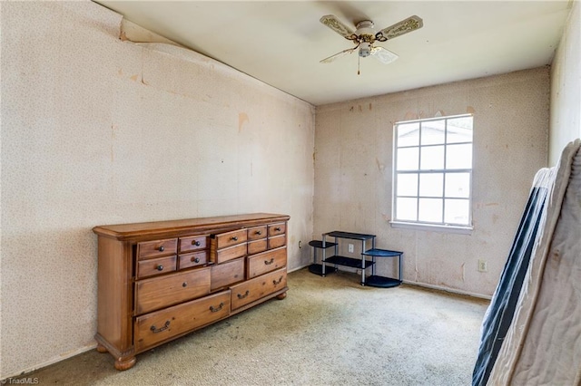 misc room featuring carpet and a ceiling fan
