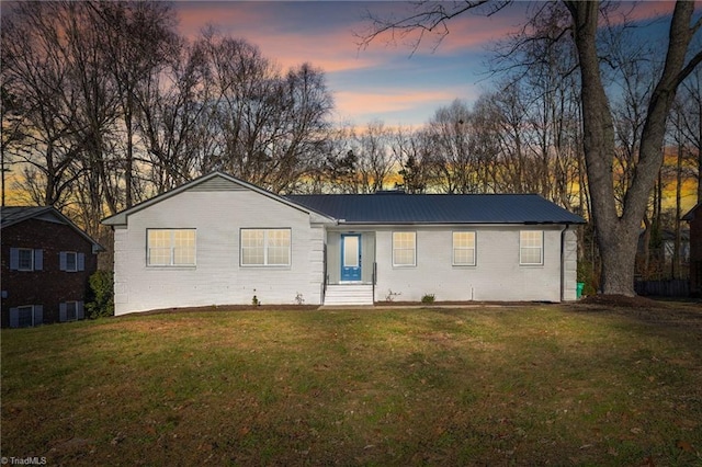 view of front of home with a lawn