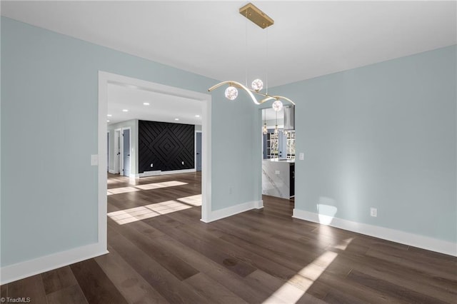 unfurnished dining area with dark hardwood / wood-style flooring