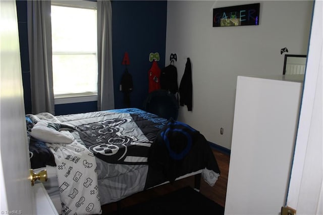 bedroom featuring wood finished floors