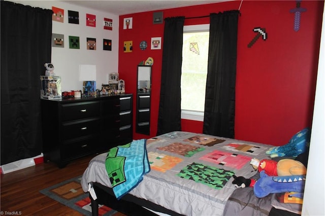 bedroom featuring wood finished floors