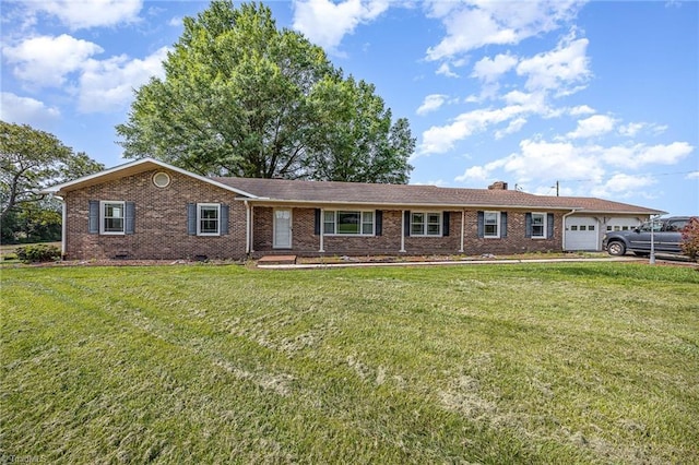 306 Pratt Rd, Dobson, NC 27017 - ranch-style house featuring a front yard, an attached garage, and brick siding