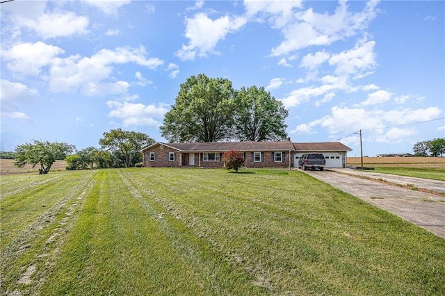 306 Pratt Rd, Dobson, NC 27017 - ranch-style house featuring a garage, concrete driveway, and a front lawn
