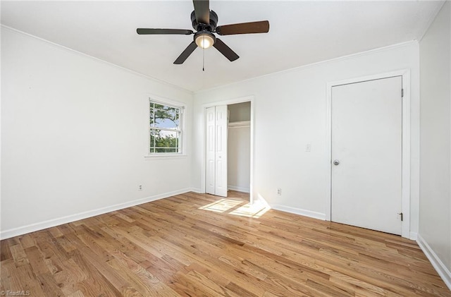 306 Pratt Rd, Dobson, NC 27017 - unfurnished bedroom with crown molding, light wood-style floors, ceiling fan, and a closet