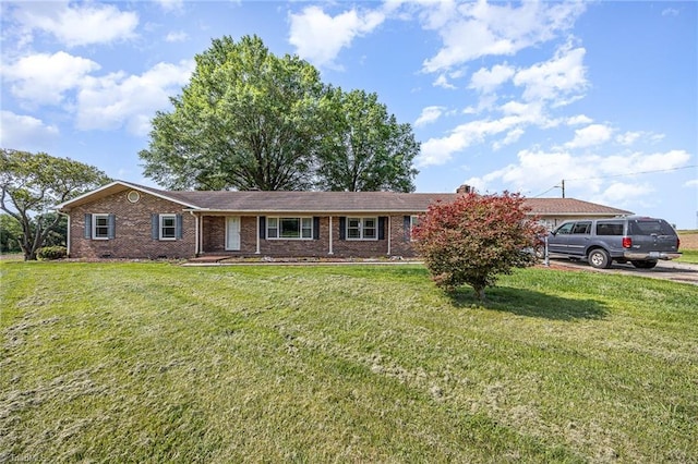 306 Pratt Rd, Dobson, NC 27017 - ranch-style house featuring a front lawn and brick siding