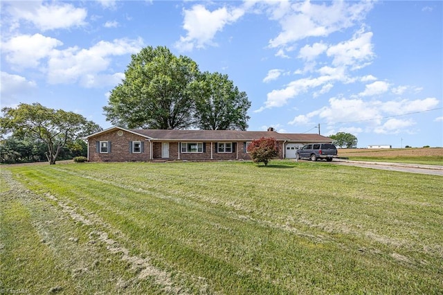 306 Pratt Rd, Dobson, NC 27017 - ranch-style home featuring driveway, a front lawn, brick siding, and an attached garage