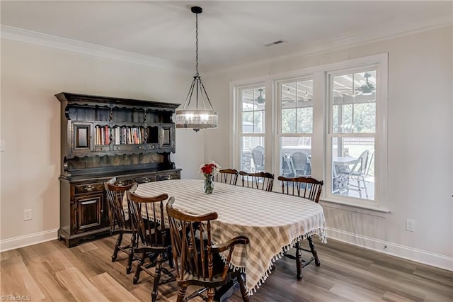 3609 Wesley Point Dr, Browns Summit, NC 27214 - dining room featuring light wood-type flooring and ornamental molding