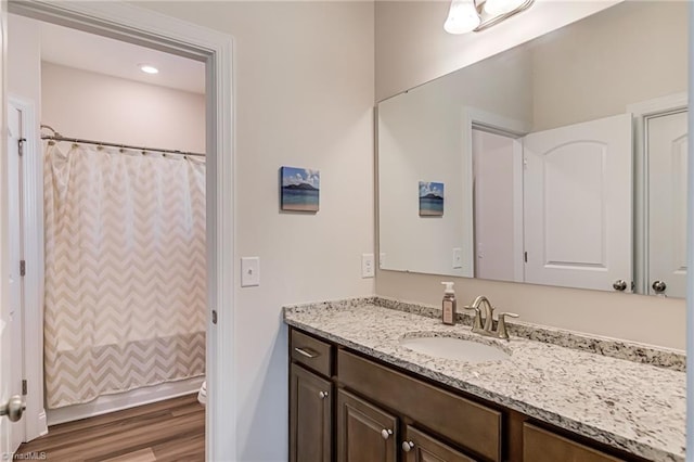 3609 Wesley Point Dr, Browns Summit, NC 27214 - full bath featuring vanity, wood finished floors, and a shower with shower curtain