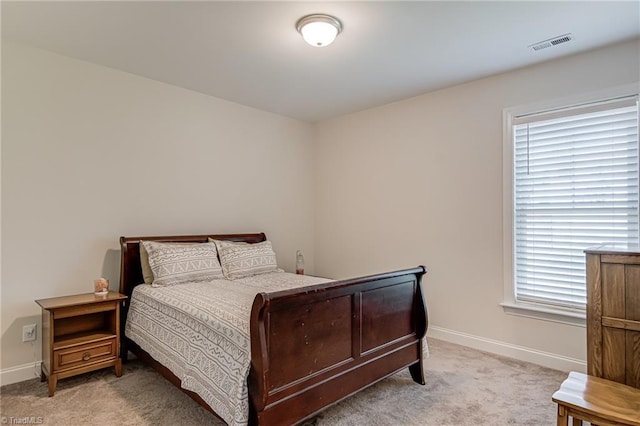 3609 Wesley Point Dr, Browns Summit, NC 27214 - bedroom with light colored carpet and multiple windows