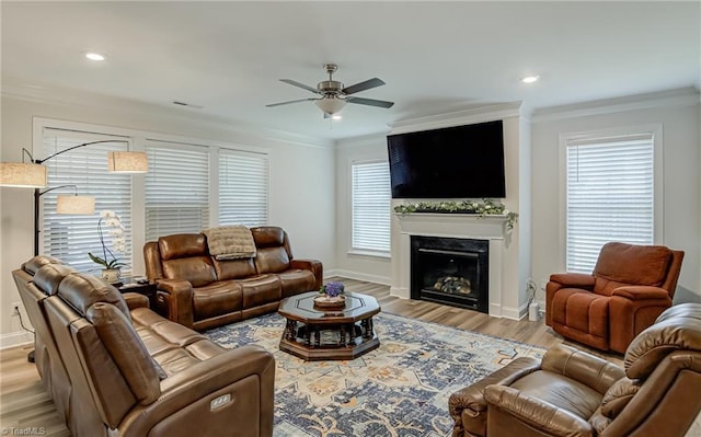 3609 Wesley Point Dr, Browns Summit, NC 27214 - living area featuring ceiling fan, crown molding, light wood finished floors, a high end fireplace, and recessed lighting