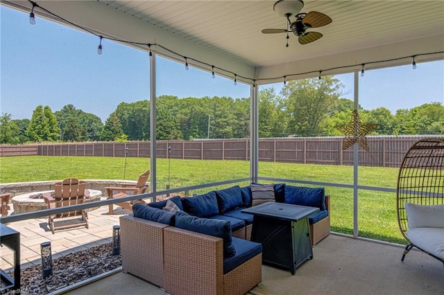 3609 Wesley Point Dr, Browns Summit, NC 27214 - fenced backyard with a patio, ceiling fan, an outdoor living space with a fire pit, and a wooded view