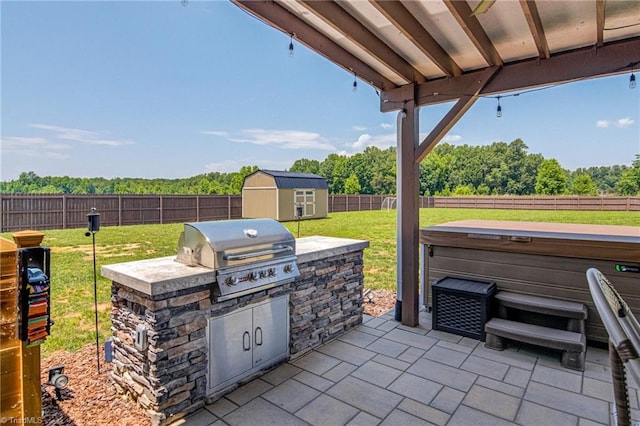 3609 Wesley Point Dr, Browns Summit, NC 27214 - fenced backyard with a hot tub, a patio, exterior kitchen, and a storage shed