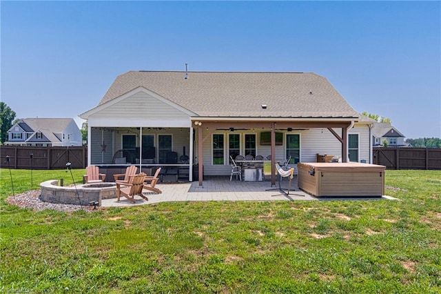 3609 Wesley Point Dr, Browns Summit, NC 27214 - back of house featuring a hot tub, a ceiling fan, a fenced backyard, and a patio area