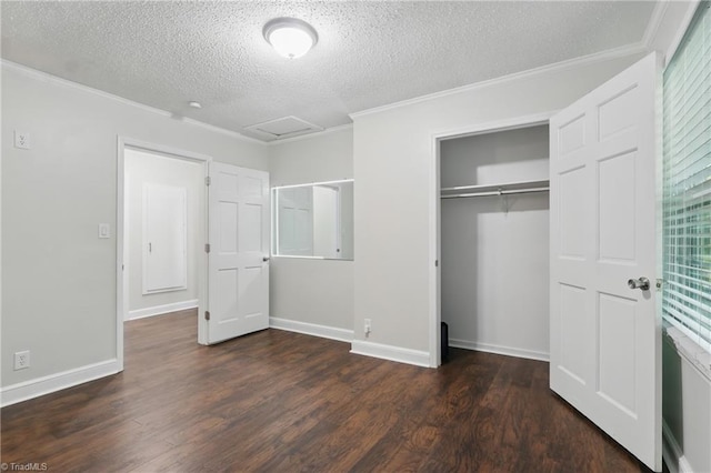 4624 Circle Dr, Winston-Salem, NC 27105 - unfurnished bedroom with a textured ceiling, wood finished floors, attic access, crown molding, and a closet