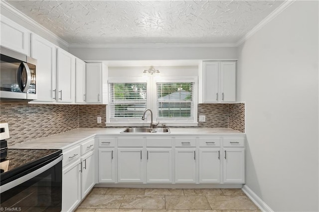 4624 Circle Dr, Winston-Salem, NC 27105 - kitchen with stainless steel microwave, electric range oven, white cabinetry, backsplash, and light countertops