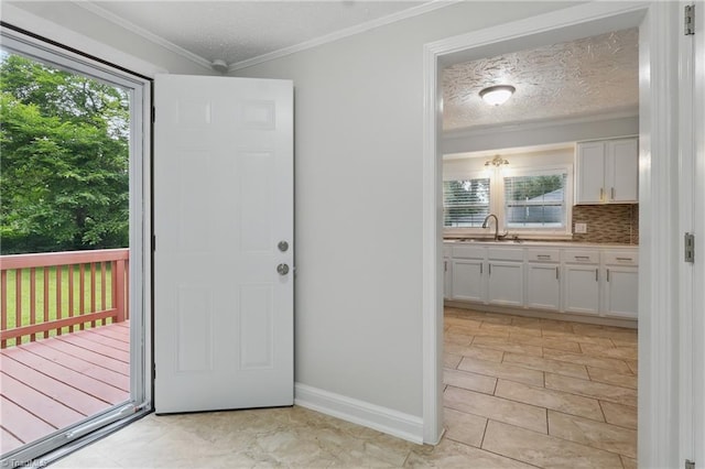 4624 Circle Dr, Winston-Salem, NC 27105 - entrance foyer with ornamental molding, healthy amount of natural light, a textured ceiling, and light tile patterned floors