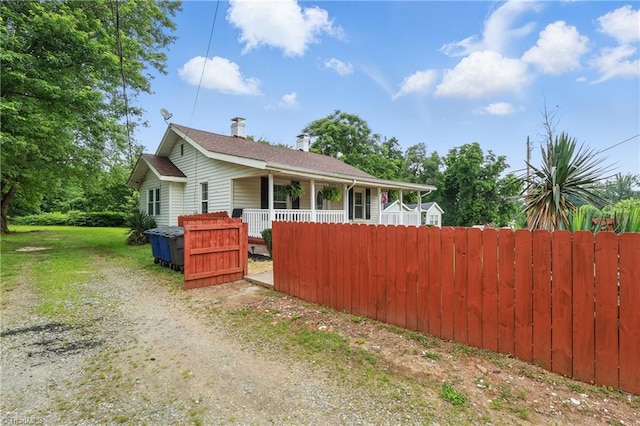 4624 Circle Dr, Winston-Salem, NC 27105 - view of front facade with covered porch and a chimney