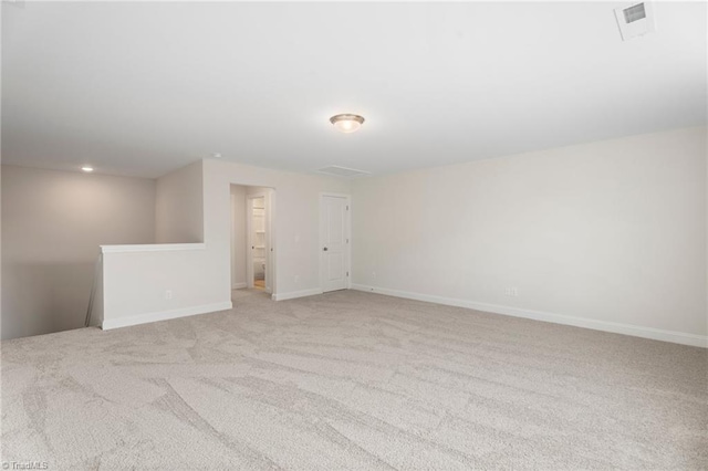 spare room with light colored carpet