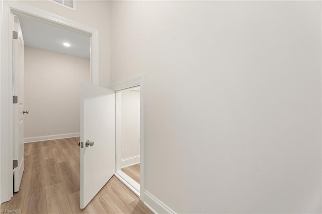 hall with light hardwood / wood-style flooring