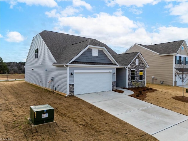 craftsman-style home featuring a garage and a front yard