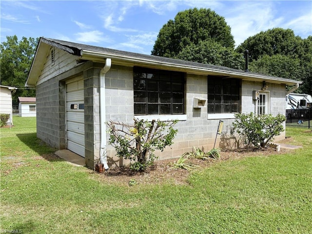 200 N 9th Ave, Mayodan, NC 27027 - view of side of home featuring a yard and concrete block siding