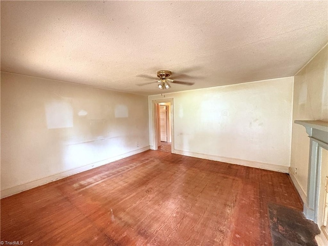 200 N 9th Ave, Mayodan, NC 27027 - spare room featuring ceiling fan, a textured ceiling, and wood finished floors