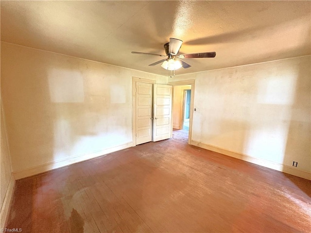 200 N 9th Ave, Mayodan, NC 27027 - unfurnished room with wood finished floors and ceiling fan