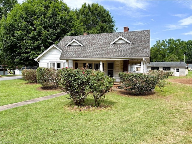 200 N 9th Ave, Mayodan, NC 27027 - view of front of home featuring roof with shingles, a chimney, a front yard, and a porch