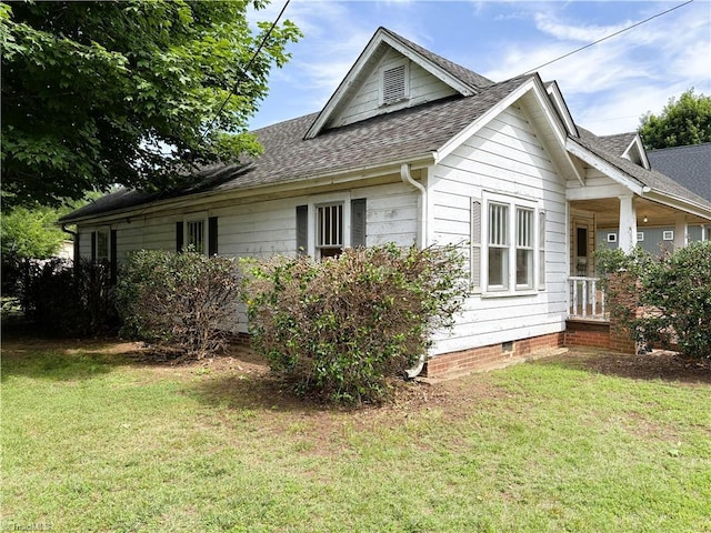 200 N 9th Ave, Mayodan, NC 27027 - view of home's exterior featuring a shingled roof, a yard, and crawl space