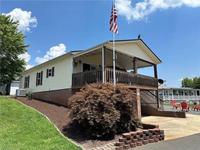 back of house with a patio and central AC unit