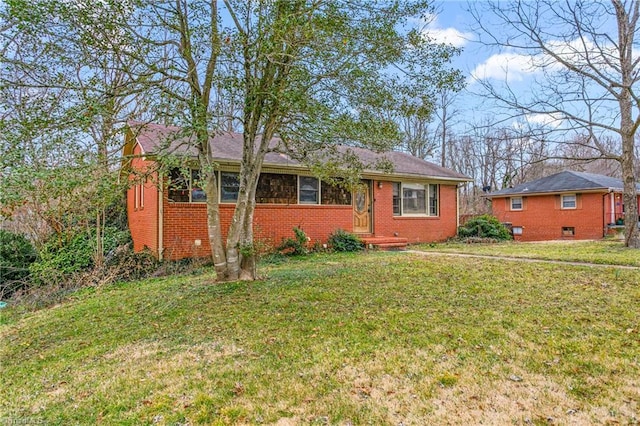 ranch-style house with a front lawn