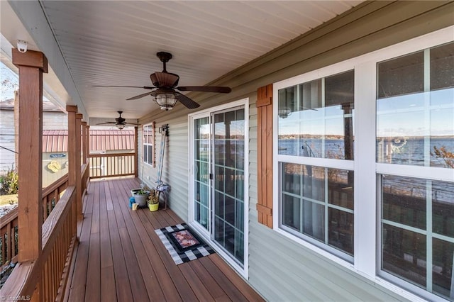 deck featuring covered porch and ceiling fan