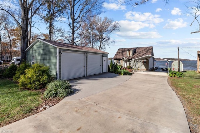 garage featuring a lawn