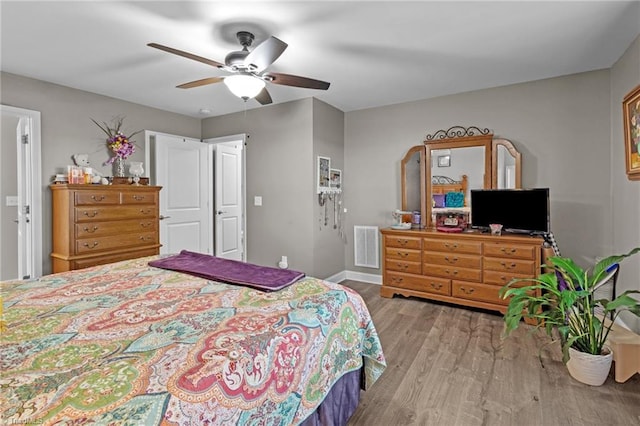 bedroom featuring ceiling fan and light hardwood / wood-style flooring