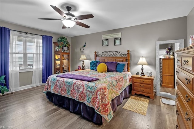 bedroom with hardwood / wood-style floors and ceiling fan