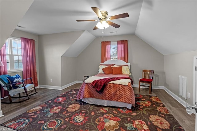 bedroom with vaulted ceiling, ceiling fan, and dark hardwood / wood-style floors