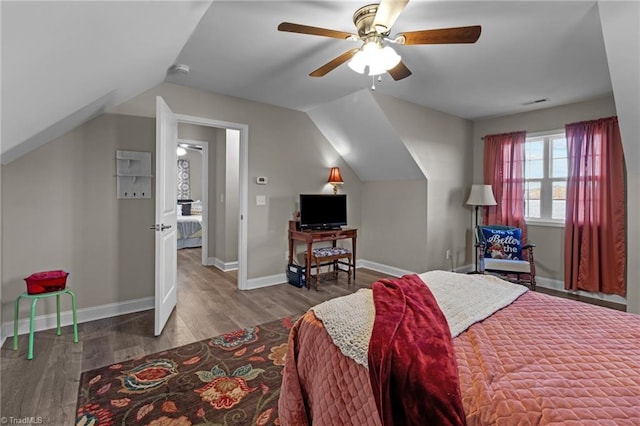 bedroom featuring hardwood / wood-style flooring, vaulted ceiling, and ceiling fan