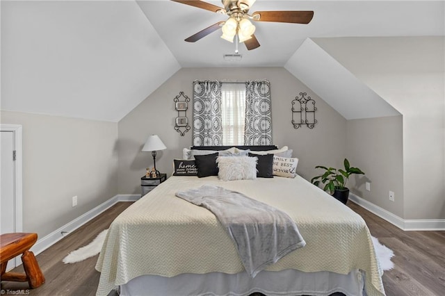 bedroom featuring hardwood / wood-style floors, ceiling fan, and lofted ceiling