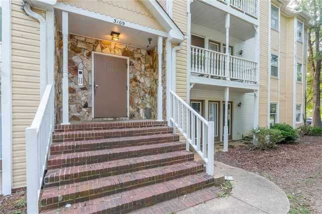 doorway to property featuring a balcony