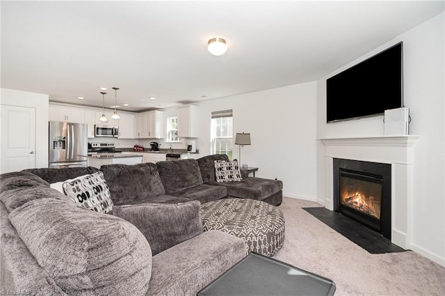 1026 Baileys Chapel Rd, Advance, NC 27006 - carpeted living room featuring a fireplace with flush hearth and recessed lighting