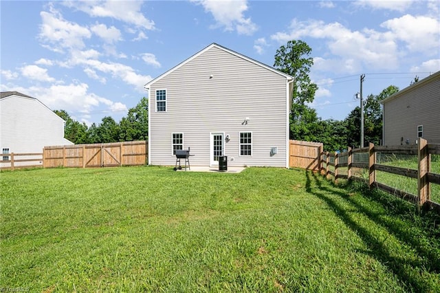 1026 Baileys Chapel Rd, Advance, NC 27006 - rear view of house featuring a fenced backyard and a patio area