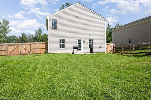 1026 Baileys Chapel Rd, Advance, NC 27006 - rear view of house with a fenced backyard